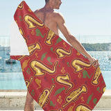Saxophone cornet pattern red background Beach Towel