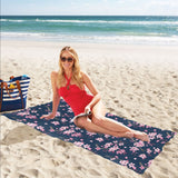 Pink sakura cherry blossom blue background Beach Towel