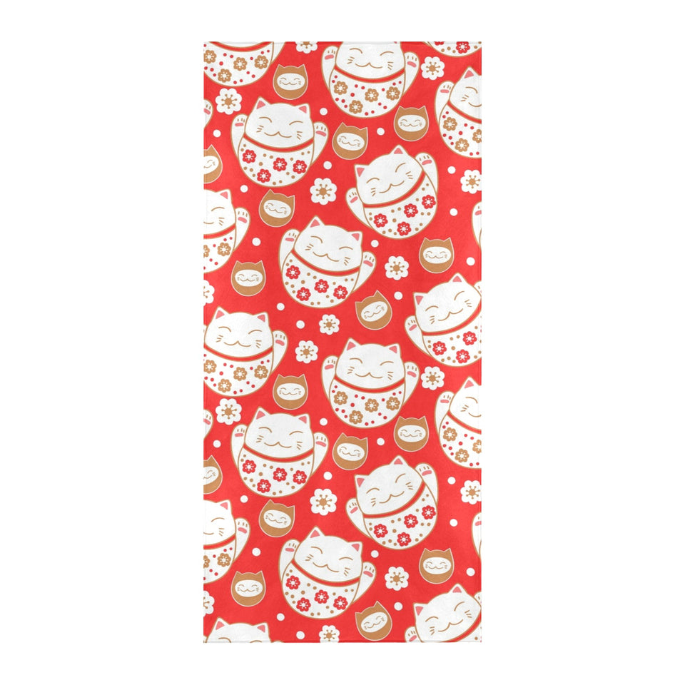 Cute Maneki neko cat red background Beach Towel