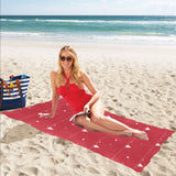 Christmas tree star snow red background Beach Towel
