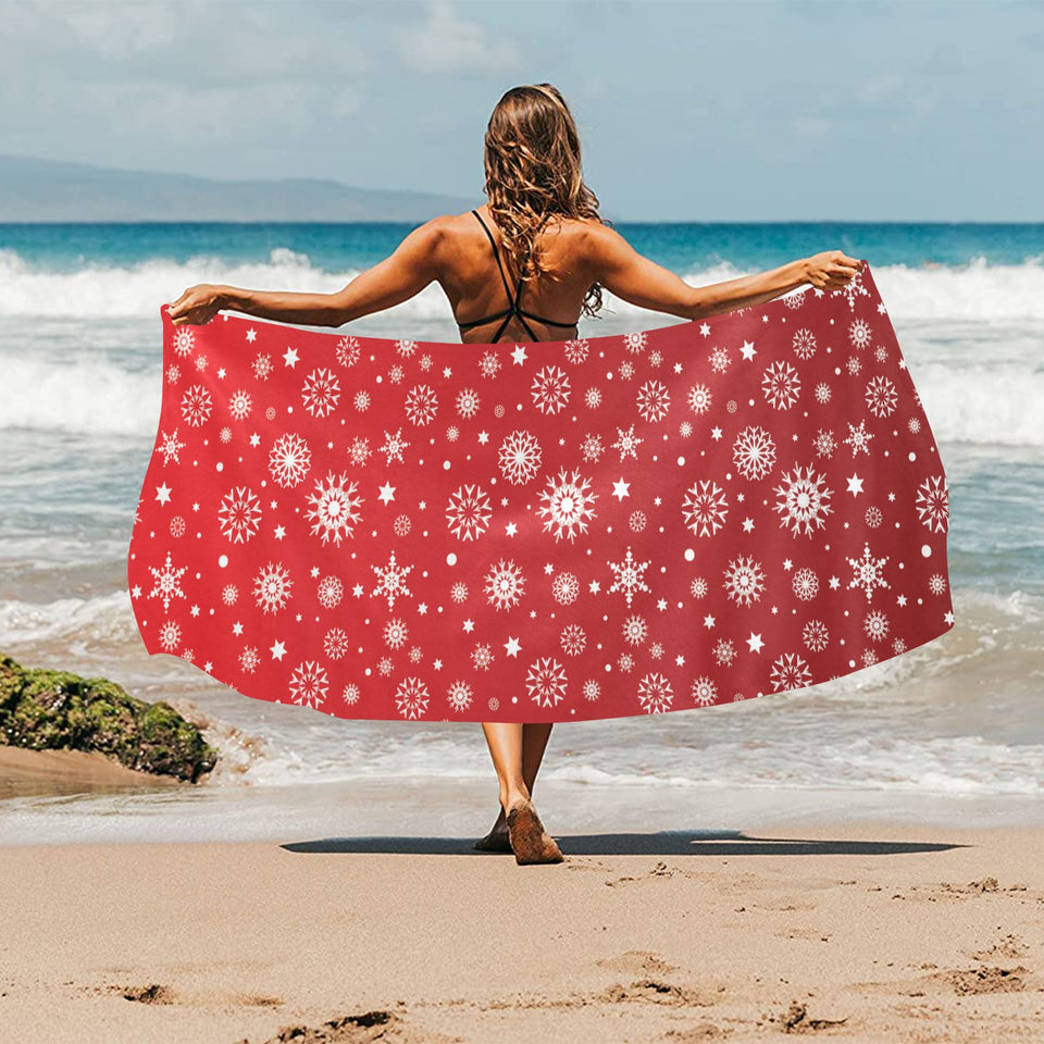 Snowflake pattern red background Beach Towel