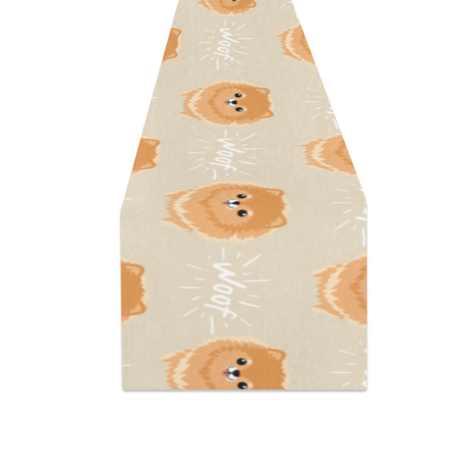 Cute brown pomeranian puppy on blue Table Runner