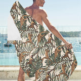 Monkey tropical leaves background Beach Towel