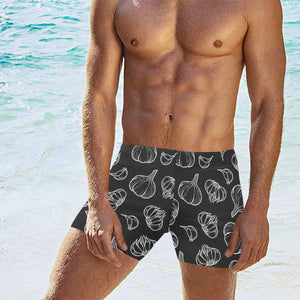 Garlic pattern black background Men's Swimming Trunks