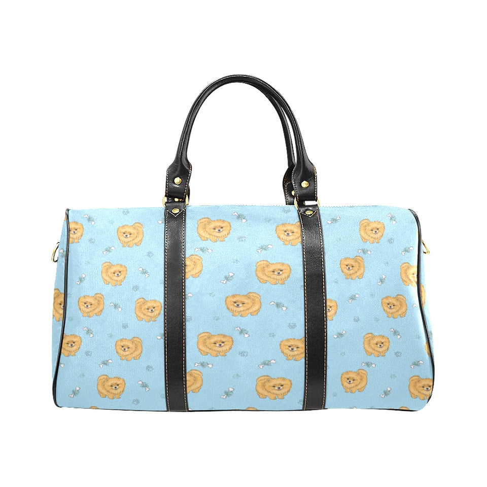 Brown cute pomeranian blue blackground Travel Bag