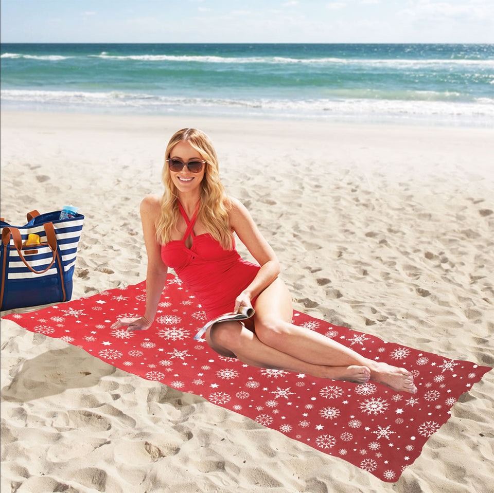 Snowflake pattern red background Beach Towel