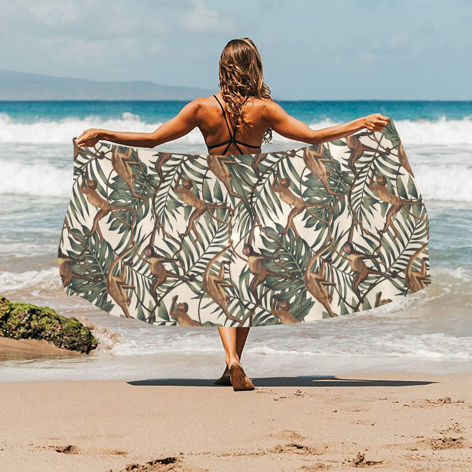 Monkey tropical leaves background Beach Towel