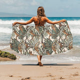 Monkey tropical leaves background Beach Towel