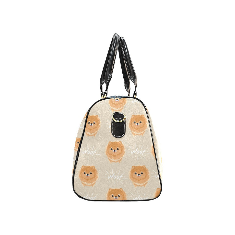 Cute brown pomeranian puppy on blue Travel Bag