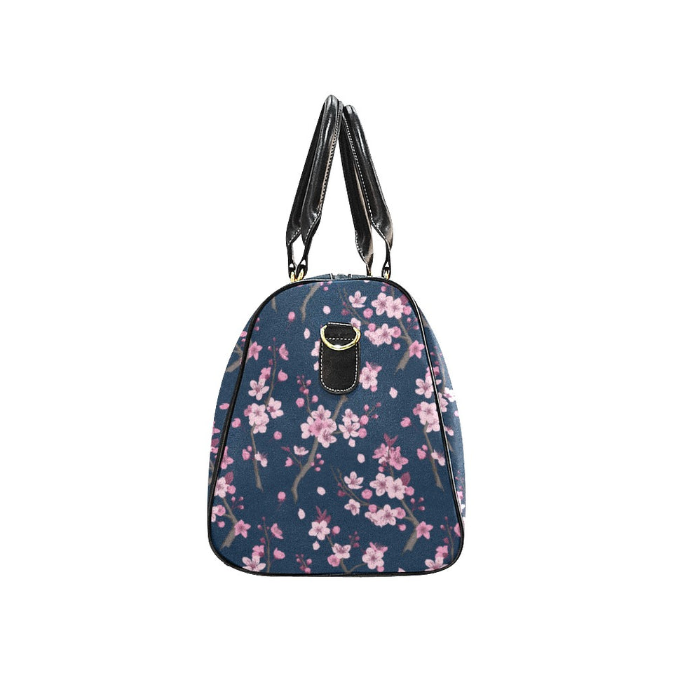 Pink sakura cherry blossom blue background Travel Bag