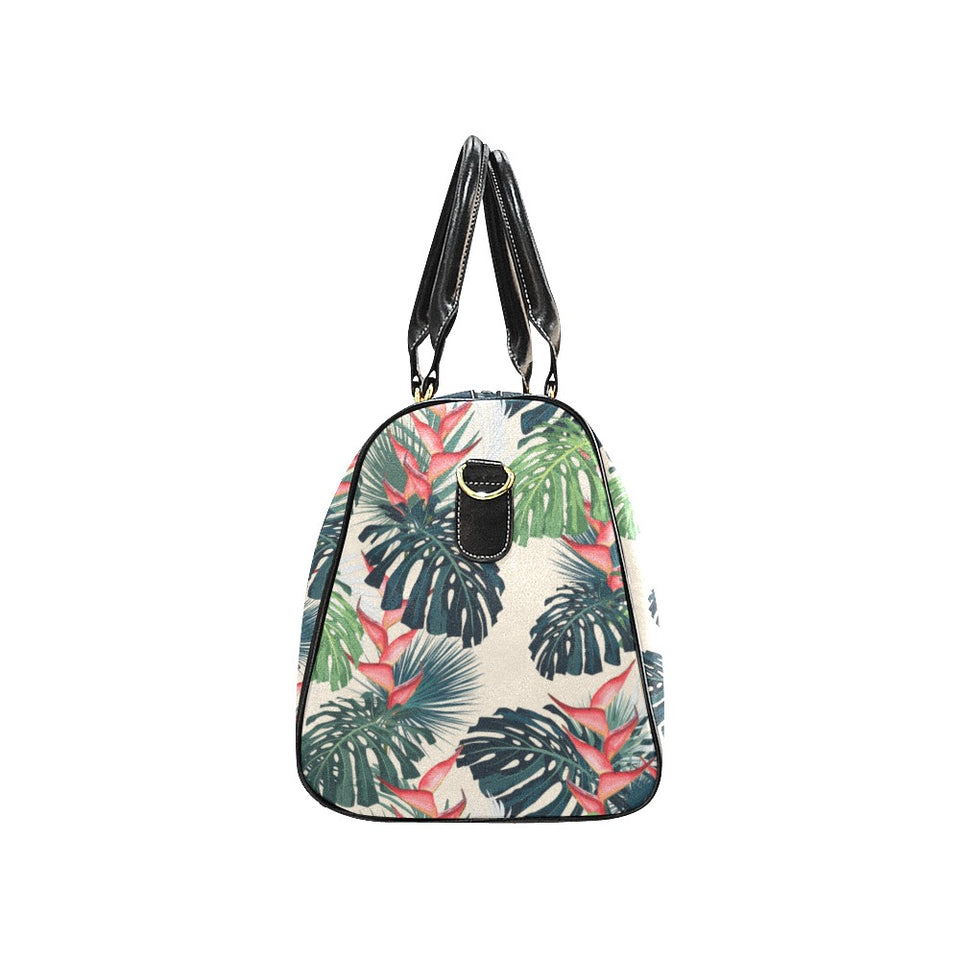 heliconia flowers, palm and monstera leaves Travel Bag