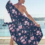 Pink sakura cherry blossom blue background Beach Towel