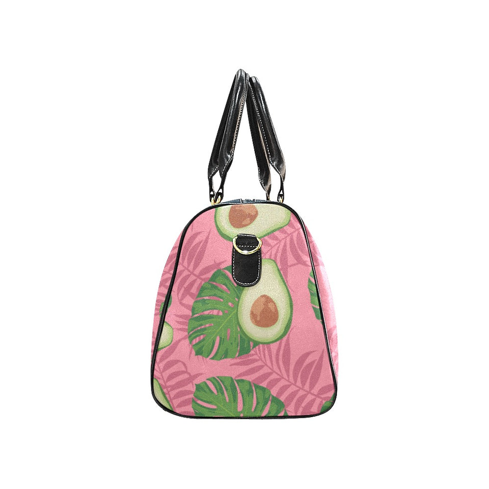Avocado slices leaves pink back ground Travel Bag