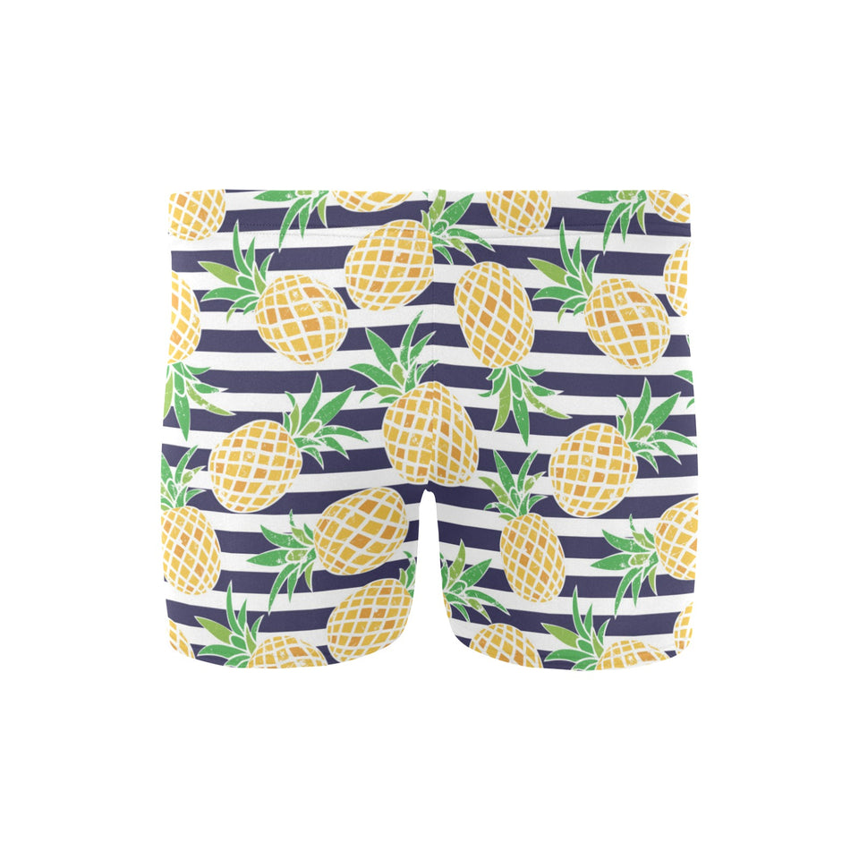 Pineapples pattern striped background Men's Swimming Trunks