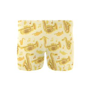Saxophone cornet pattern yellow background Men's Swimming Trunks