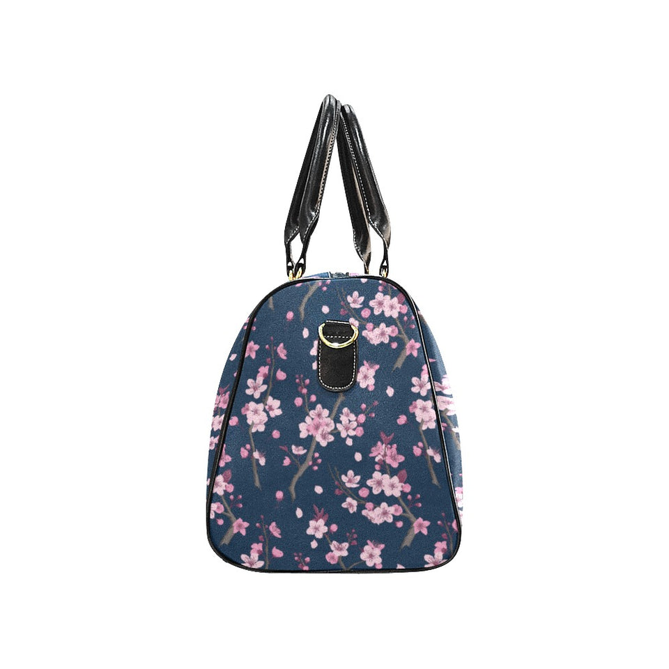 Pink sakura cherry blossom blue background Travel Bag