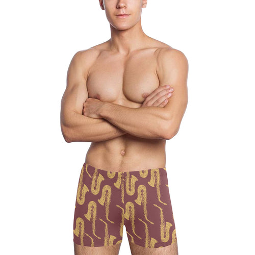 Hand drawn gold saxophone red background Men's Swimming Trunks