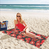 Tomato black background Beach Towel