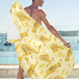 Saxophone cornet pattern yellow background Beach Towel