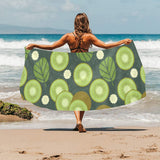 Whole sliced kiwi leave and flower Beach Towel